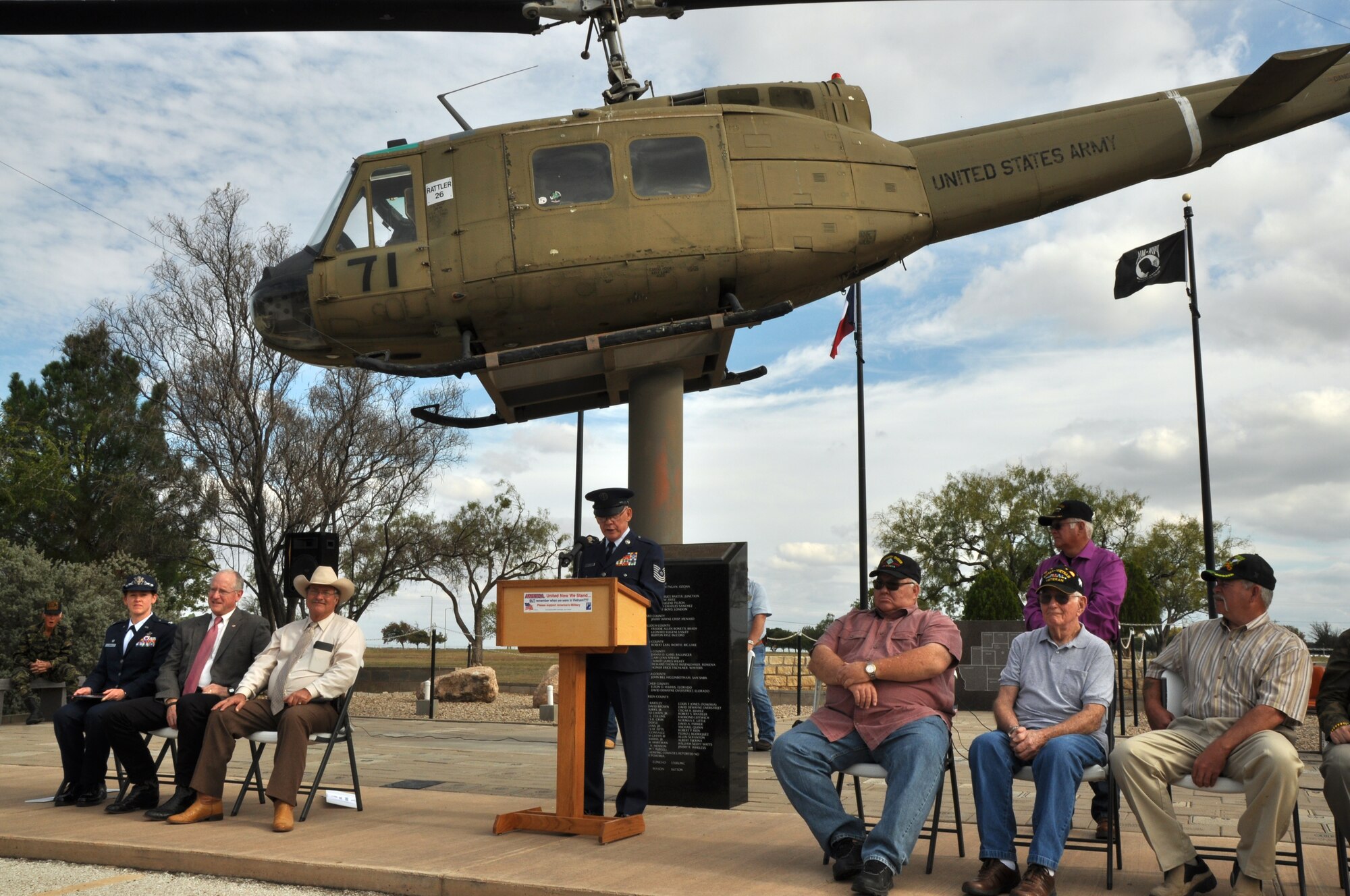 SAN ANGELO, Texas - Retired Master Sgt. Tom Davis announces that four veterans names were added to the paving stone surrounding the Mathis Field Vietnam Veterans Memorial during the Veterans Day observance Nov. 11. All four of the veterans were men who served during the Vietnam War or World War II. (U.S. Air Force photo/ Airman 1st Class Joshua Edwards)