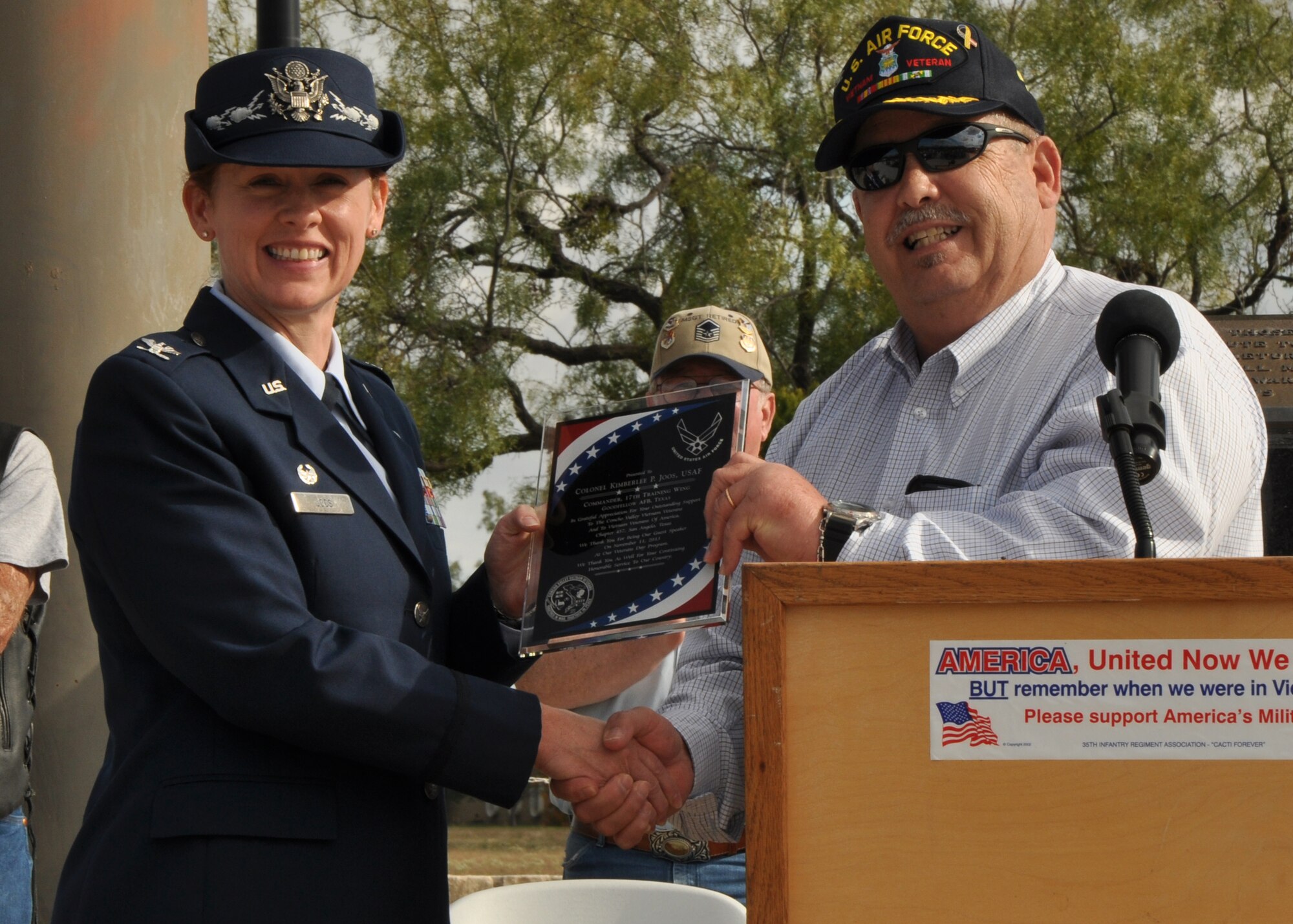 SAN ANGELO, Texas – Col. Kimberlee Joos, 17th Training Wing Commander, receives a plaque from Vietnam Veterans of America Chapter 437 during the Veterans Day observance at Mathis Field Vietnam Memorial Nov. 11. Chapter 437 gave Col. Joos the plaque as thanks for her continued service to the country and for being the guest speaker at the observance. (U.S. Air Force photo/ Airman 1st Class Joshua Edwards)