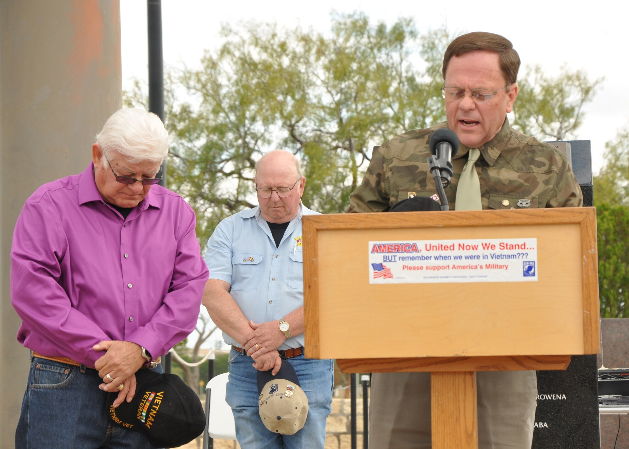 SAN ANGELO, Texas – Retired Chaplain Travis Mundy provides the opening prayer for the Veterans Day observance at the Mathis Field Vietnam Memorial Nov. 11. Mundy gave his thanks for the opportunity that everyone present could join together that Veterans Day. (U.S. Air Force photo/ Airman 1st Class Joshua Edwards)