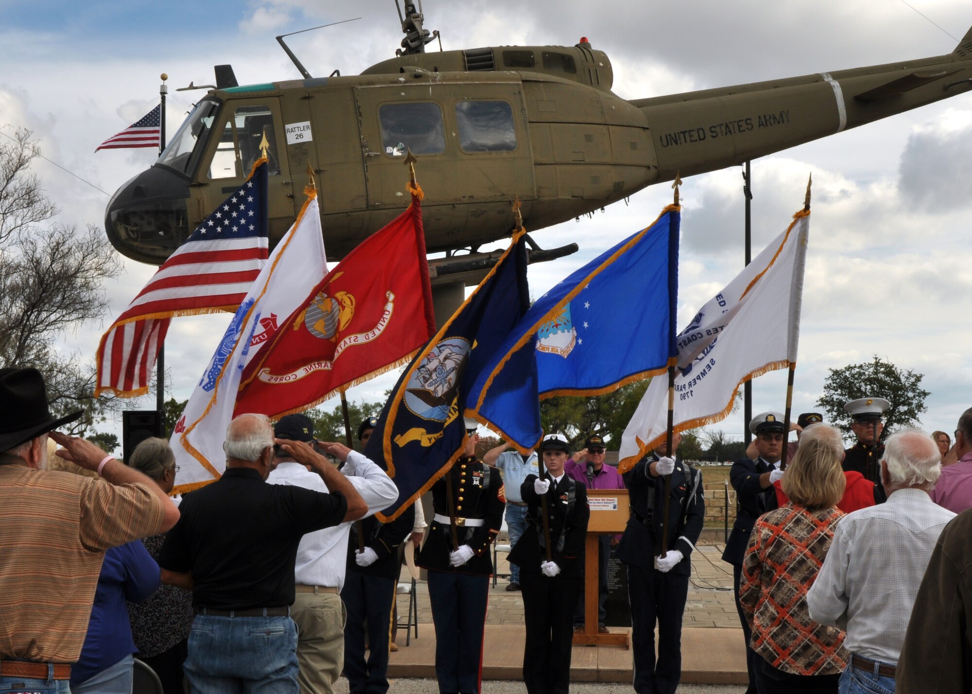 SAN ANGELO, Texas - The Goodfellow Joint Service Color Guard presents the colors in front of the Mathis Field Vietnam Memorial during the Veterans Day observance Nov. 11. While the color guard presented the colors, the Harmony Belles, a non-profit San Angelo choir, sang the national anthem. (U.S. Air Force photo/ Airman 1st Class Joshua Edwards)