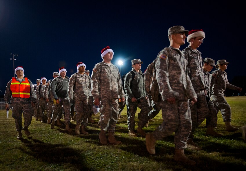 Soldiers from the Army Detachment of the Naval School Explosive Ordnance Disposal march in formation to the Airman’s Attic to drop off toys for Eglin’s annual holiday toy drive Nov. 13.  More than 300 Soldiers participated in the march.  The toy giveaway is Nov. 23 from 8 a.m. to 3 p.m. at Bldg. 615.  The giveaway is open to servicemembers E-6 and below.  Donation will be accepted through Nov. 21.  (U.S. Air Force photo/Samuel King Jr.)