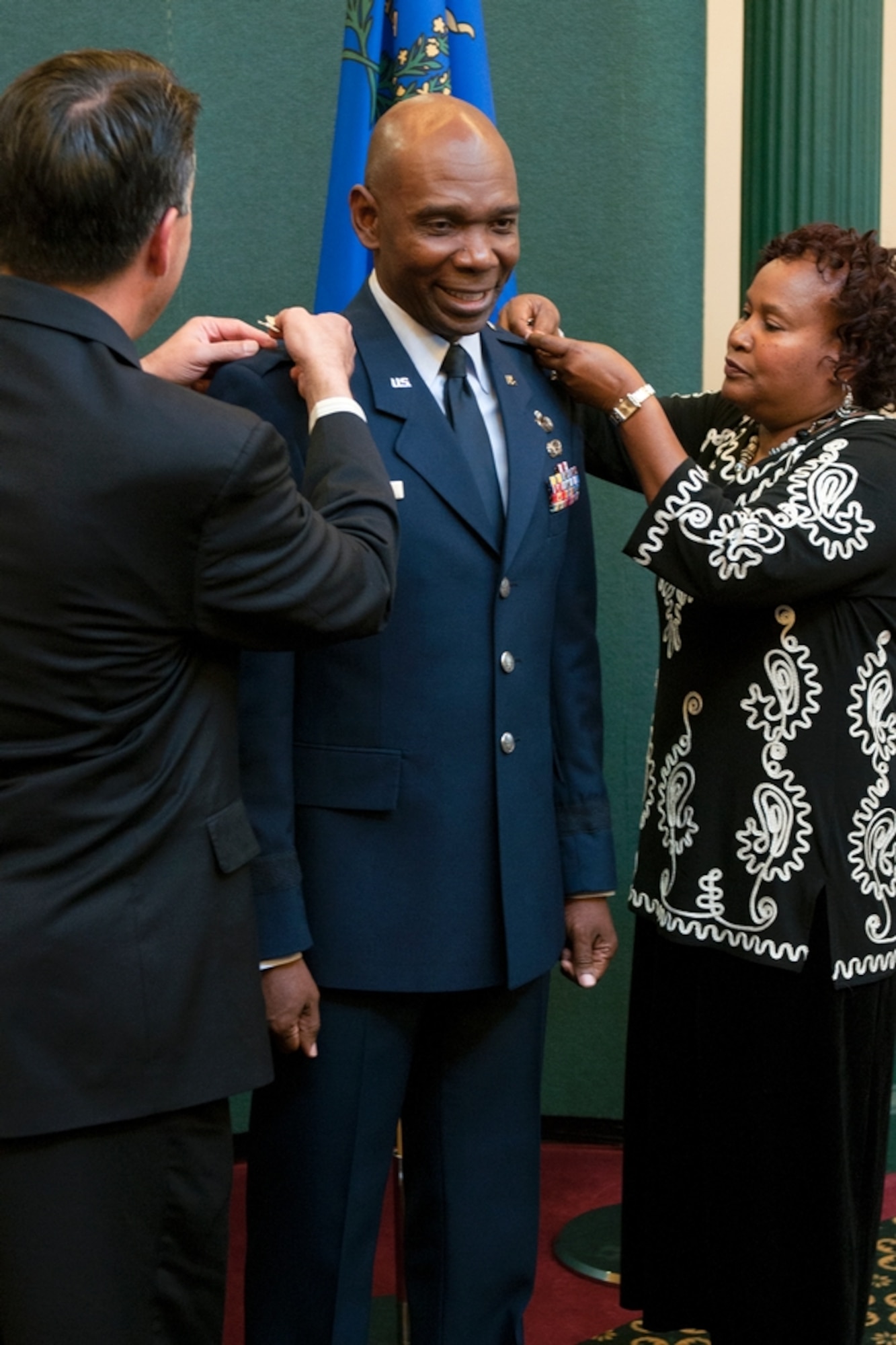 Ondra Berry, center, receives his stars marking his promotion to brigadier general from Gov. Brian Sandoval and his wife Margo Berry during a ceremony in the Guinn Room at the Nevada Capitol on Nov.12. Berry is the first African-American general in the Nevada Guard and is now the Nevada Air Guard’s assistant adjutant general.
Photo by Staff Sgt. Mike Getten, Joint Force Headquarters Public Affairs
