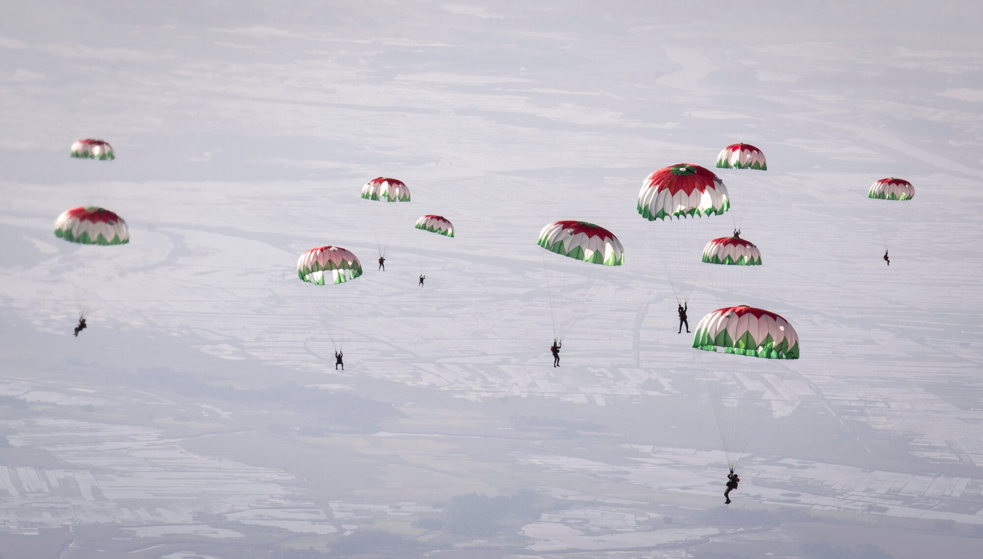 Bangladeshi paratroopers descend from an U.S. Air Force C-130 Hercules, during exercise Cope South over Bangladesh, Nov. 12, 2013. The exercise cultivated common bonds, fostered goodwill, and improved readiness and compatibility between members of the Bangladesh and U.S. Air Force. (U.S. Air Force photo by Captain Raymond Geoffroy/Released)