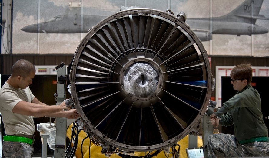 U.S. Air Force Airman 1st Class Hector Casado-Delgado (left), and Senior Airman Shelby Fields, both assigned to the 7th Component Maintenance Squadron, start the disassembly of a General Electric F101-102 turbofan jet engine from a B-1B Lancer, Nov. 13, 2013, at Dyess Air Force Base, Texas. Aerospace Propulsion technicians are responsible for maintaining, diagnosing, and repairing jet engines. The B-1B Lancer is equipped with four F101-102 engines. (U.S. Air Force photo by Staff Sgt. Richard Ebensberger/Released)