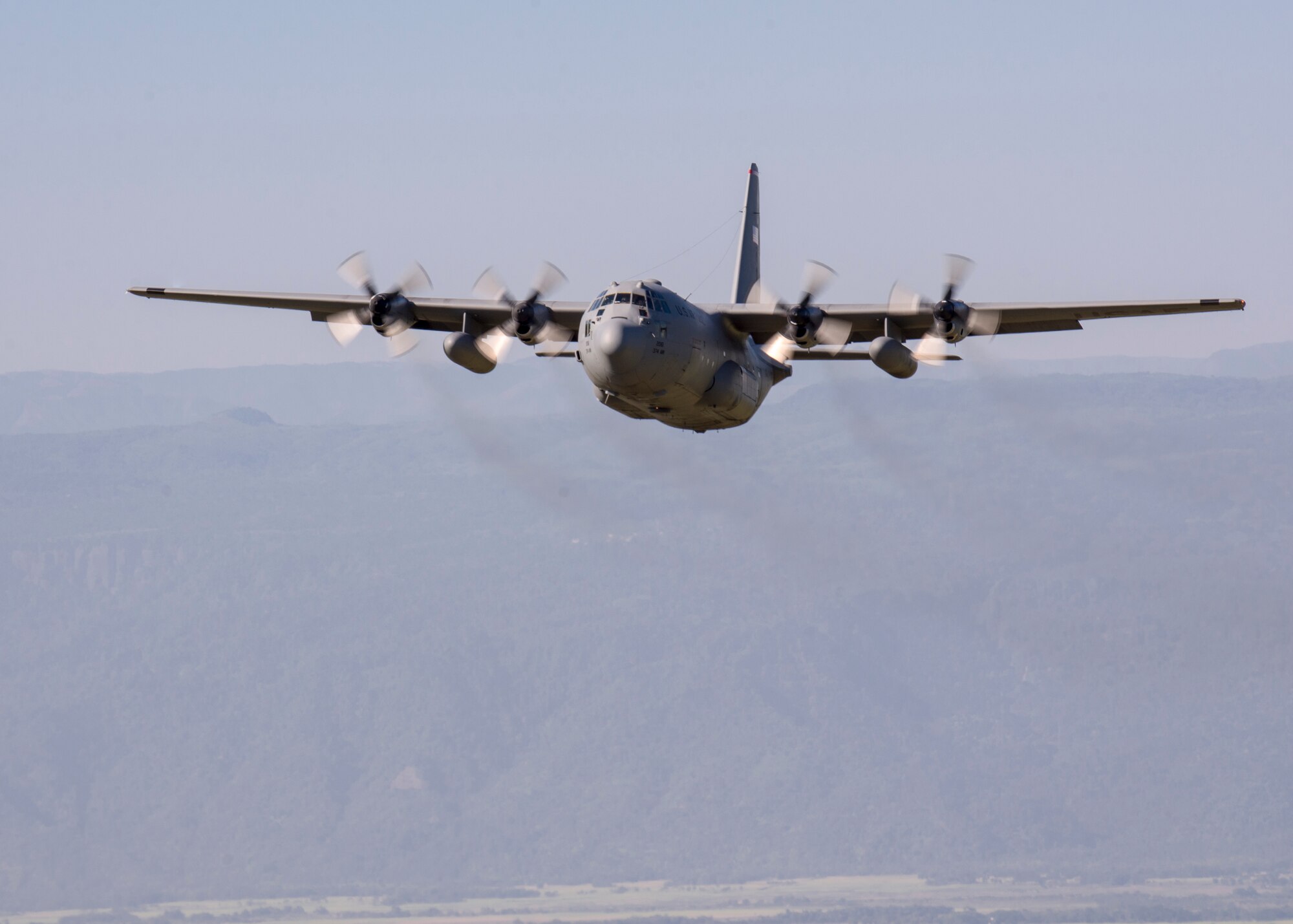An U.S. C-130 Hercules flies over Bangladesh, Nov. 10, 2013. The aircraft performed airlift missions during exercise Cope South. (U.S. Air Force photo by Captain Raymond Geoffroy/Released)