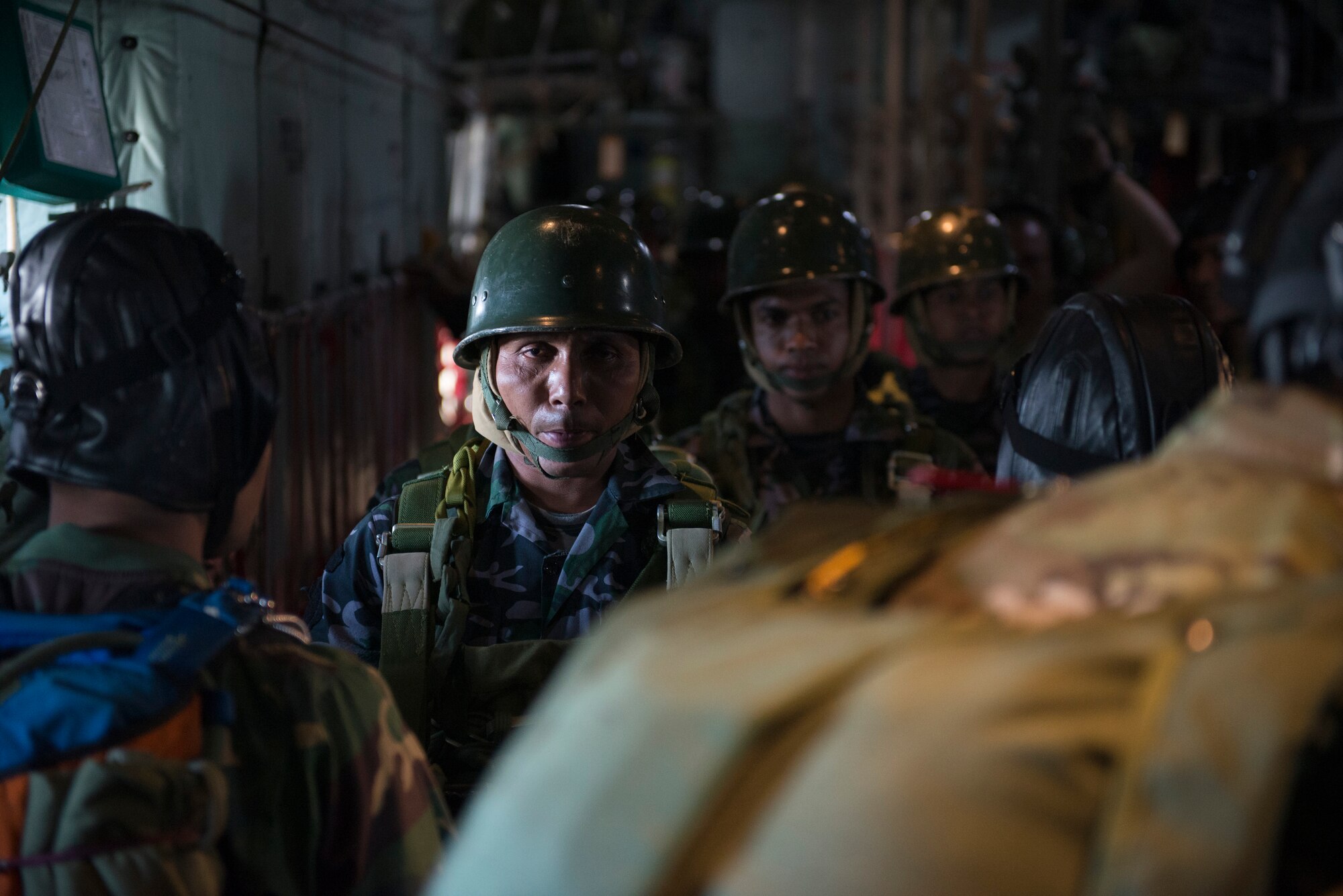 Bangladeshi paratroopers await a jump aboard an U.S. Air Force C-130 Hercules during exercise Cope South over Bangladesh, Nov. 10, 2013. The exercise cultivated common bonds, fostered goodwill, and improved readiness and compatibility between members of the Bangladesh and U.S. Air Force. (U.S. Air Force photo by Captain Raymond Geoffroy/Released)