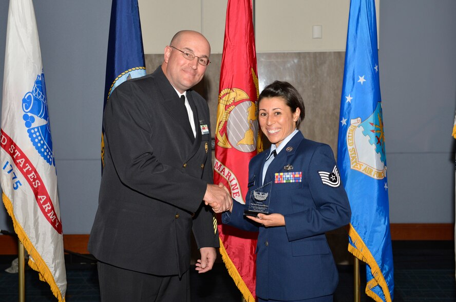 KNOXVILLE, Tenn. - Tech. Sgt. Jenny Sanchez Liermann, right, an I.G. Brown Training and Education Center (TEC) instructor, is recognized for her outstanding service along with other area enlisted service members. The 31st Annual Veterans Day Luncheon recognizes local military unit honorees by the East Tennessee Military Affairs Council at the Knoxville Convention Center. About a dozen Airmen from the TEC attended, Nov. 11, 2013. (U.S. Air National Guard photo by Master Sgt. Kurt Skoglund/Released)