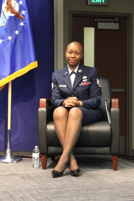 BUCKLEY AIR FORCE BASE, Colo. -- Staff Sgt. Kimberly Gilbert, who recently finished with treatments for breast cancer, prepares to be pinned on as technical sergeant, June 7, at Air Reserve Personnel Center, where she works as a recognitions service team specialist. (U.S. Air Force photo)