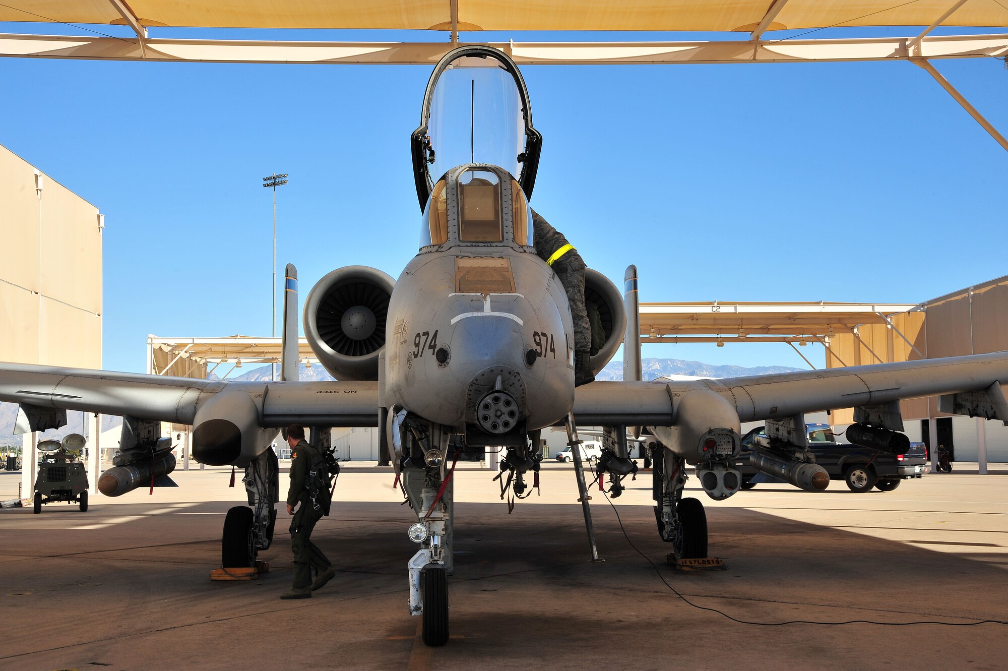 U.S. Air Force 1st Lt. William Piepenbring, 355th Training Squadron pilot, and Airman 1st Class William Flores, 355th Aircraft Maintenance Squadron crew chief, perform a preflight check at Davis-Monthan Air Force Base, Ariz., Nov. 8, 2013. The pilots and crew chiefs must complete a list of preflight safety checks to help prevent any inflight emergencies.(U.S. Air Force photo by Senior Airman Josh Slavin/Released)