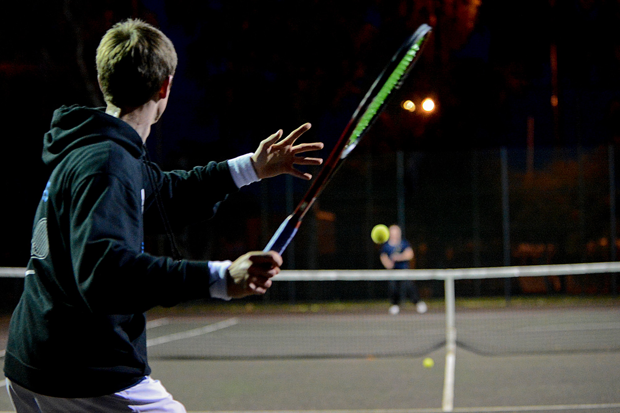 Peter Kovats, Lakenheath High School sophomore tennis player and son of Col. Peter Kovats, 48th Medical Group aerospace medicine chief, prepares to swing at a Royal Air Force Lakenheath tennis court Nov. 7, 2013. Kovats won the DODDS-Europe tennis championship by defeating Fabian Sandrup Selvik from the International School of Brussels, 6-2, 6-3. (U.S. Air Force photo by Airman 1st Class Trevor T. McBride)