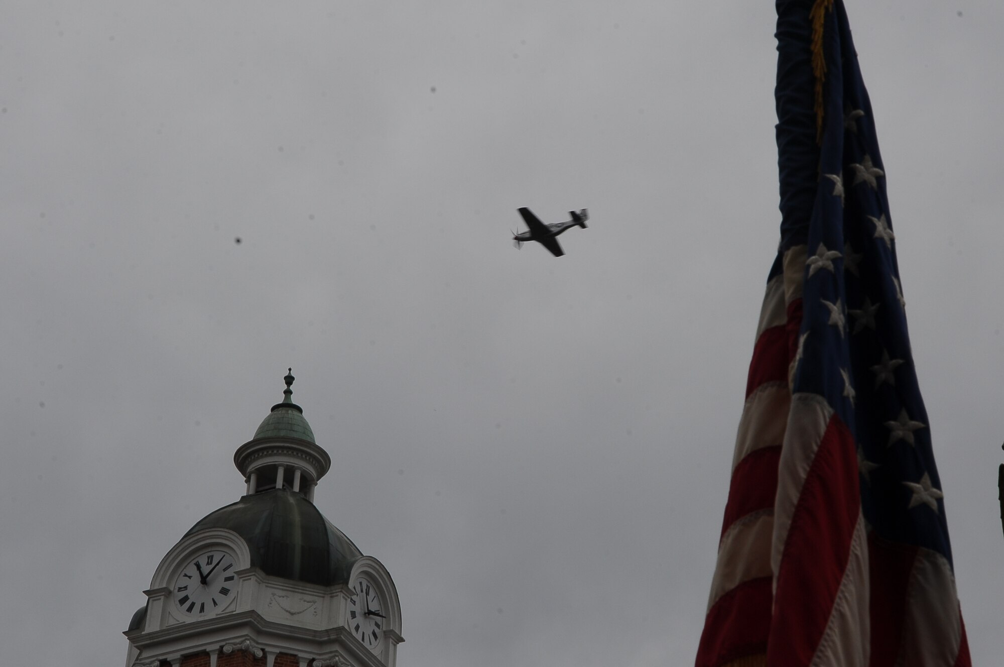 At exactly 11:11 a.m., a P-51 Mustang soared over the Lowndes County Courthouse during the Wreath Laying Ceremony Nov. 9. (U.S. Air Force Photo/Airman Daniel Lile)