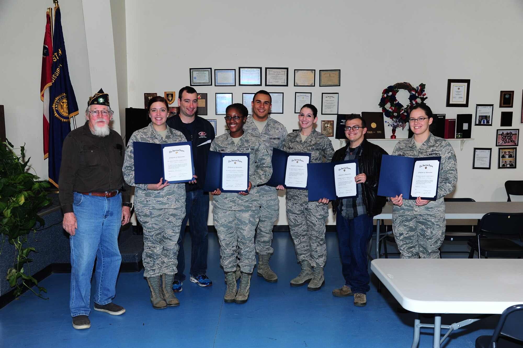 Members of the American Legion Post 69 awarded volunteers from Columbus Air Force Base with certificates and coins at a ceremony Nov. 12. The volunteers spent the afternoon on Oct. 26 painting two parking spaces in honor of Prisoners of War or service members that had gone Missing in Action. (U.S. Air Force Photo/Airman 1st Class Stephanie Englar) 