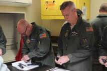 YOUNGSTOWN AIR RESERVE STATION, Ohio—U.S. Air Force Reserve Lieutenant Col. John Kochansky and Lieutenant Col. Col Bob Shemer clean their M9s after qualifying at 910th Combat Arms and Maintenance Center here, Nov. 3, 2013. CATM works year-round to ensure Service members are highly trained and qualified on various weapons systems. (U.S .Air Force photo/ TSgt Rick Lisum)