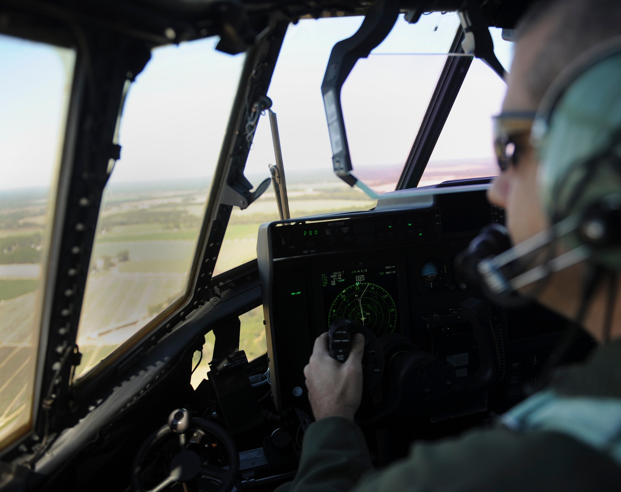U.S. Air Force Maj. Eric Lipp, 71st Rescue Squadron assistant director of operations, pilots an HC-130J Combat King II at Moody Air Force Base, Ga., Nov. 8, 2013. The 71st RQS pilots conducted several training flights to ensure safety before allowing pararescuemen on board. (U.S. Air Force photo by Senior Airman Olivia Bumpers/Released)