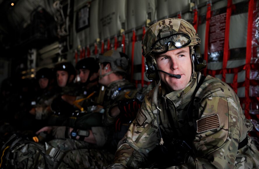 U.S. Air Force Senior Airman Brandon Smith, 38th Rescue Squadron primary jumpmaster, waits to depart from Moody Air Force Base, Ga., Nov. 8, 2013. This was the 38th RQS pararescuemen’s first static-line jump out of the new HC-130J Combat King II. (U.S. Air Force photo by Senior Airman Olivia Bumpers/Released)