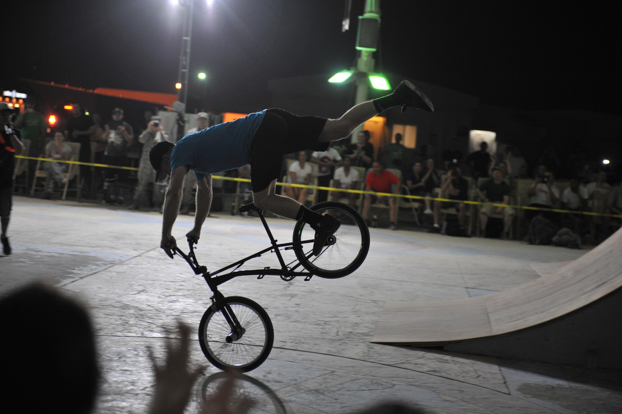Scott Powell practices flatland tricks before a Bikes Over Baghdad demonstration at the 379th Air Expeditionary Wing in Southwest Asia, Nov. 9, 2013. Powell has been a member of Bikes Over Baghdad for a number of years and specializes in flatland tricks. (U.S. Air Force photo/Master Sgt. David Miller)