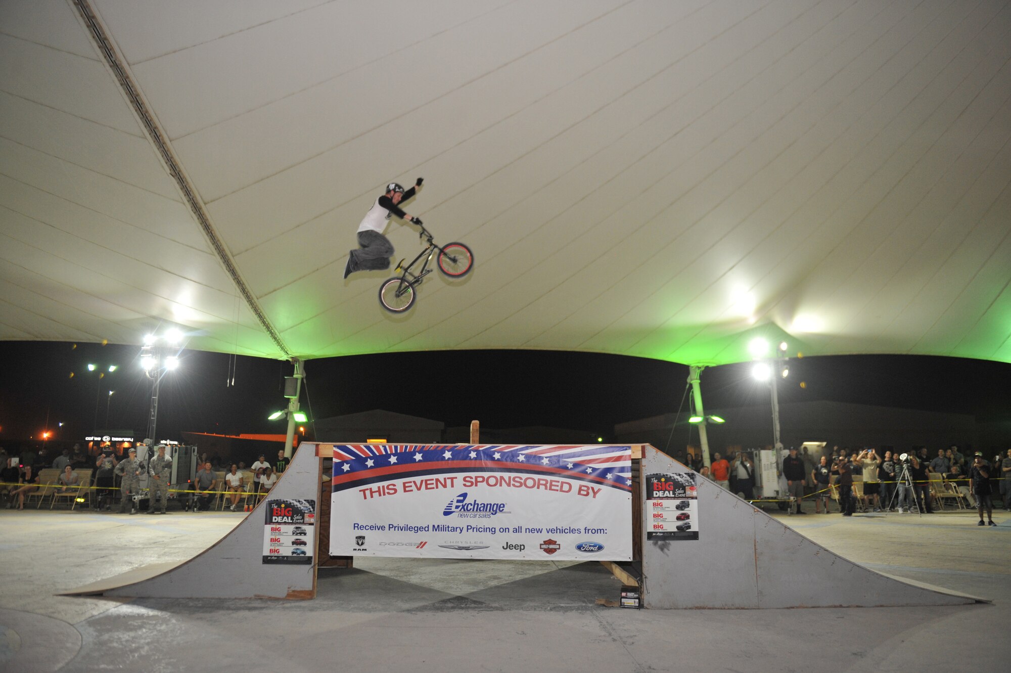Morgan Wade jumps from ramp to ramp during a Bikes Over Baghdad demonstration at the 379th Air Expeditionary Wing in Southwest Asia, Nov. 9, 2013. Wade is a professional BMX rider with the Bikes Over Baghdad group and has performed for deployed service members throughout the world. (U.S. Air Force photo/Master Sgt. David Miller)