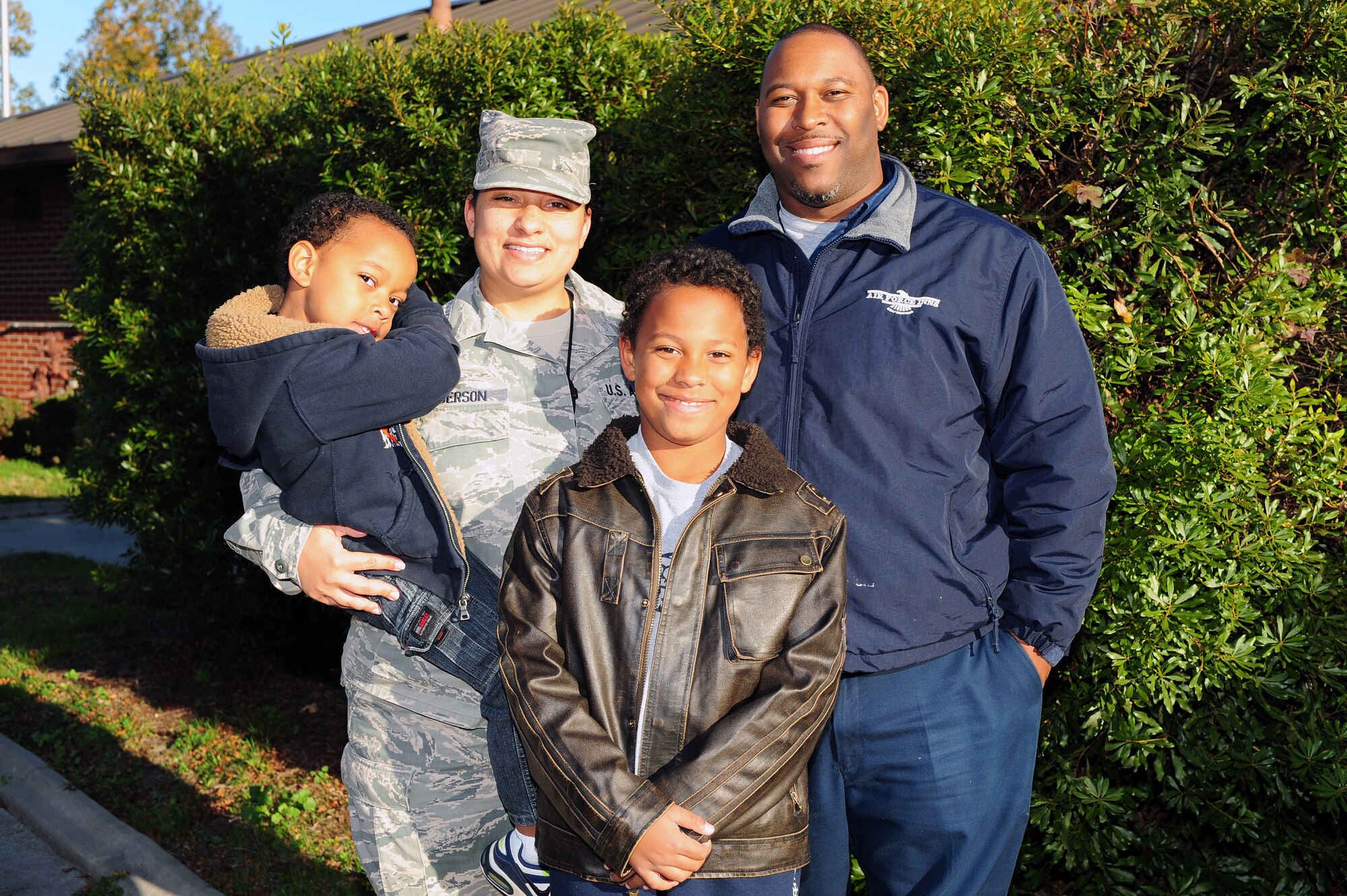 U.S. Air Force Tech. Sgt. Jennifer Anderson, 4th Fighter Wing command post controller, poses with her family for a portrait at Seymour Johnson Air Force Base, N.C., Nov. 13, 2013. To recognize all the military families here at Seymour Johnson Air Force Base, a block party will be held Nov. 16 from 11 a.m. to 2 p.m., featuring carnival games, face painting, bouncy castles and much more. (Courtesy photo)