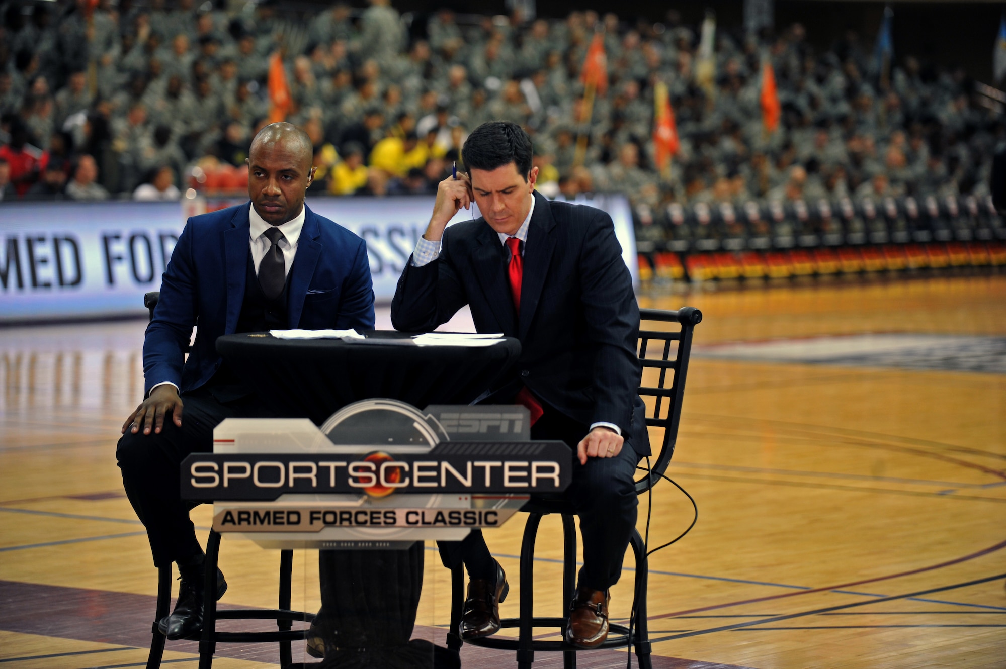 Jay Williams and Kevin Connors, ESPN college basketball personalities, prepare to go on the air before the Armed Forces Classic at U.S. Army Garrison Humphreys, Republic of Korea, Nov. 9, 2013. The last time a regular-season college game was held in Asia was 1982, when a Ralph Sampson-led University of Virginia and a Hakeem Olajuwon-led University of Houston played in Tokyo. (U.S. Air Force photo/Senior Airman Siuta B. Ika)