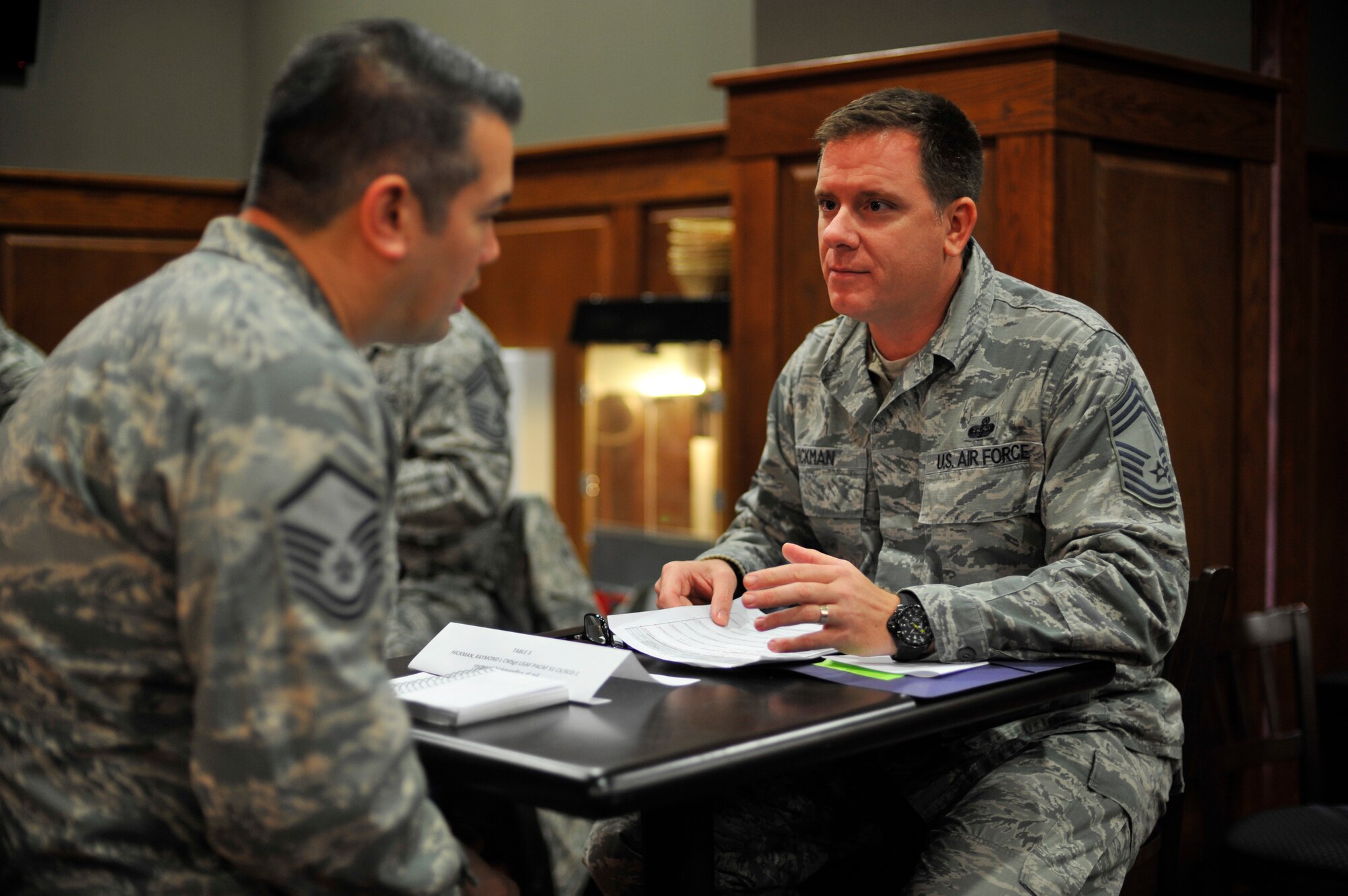 Chief Master Sgt. Raymond Hickman, 51st Communications Squadron operations superintendent, mentors Master Sgt. James Howey, 303rd Intelligence Squadron flight chief, during the first Leadership GPS speed mentoring session at Osan Air Base, Republic of Korea, Nov. 13, 2013. The Osan Chiefs Group mentored senior NCOs to help them with their development among the enlisted corps. (U.S. Air Force photo/Staff Sgt. Emerson Nuñez)