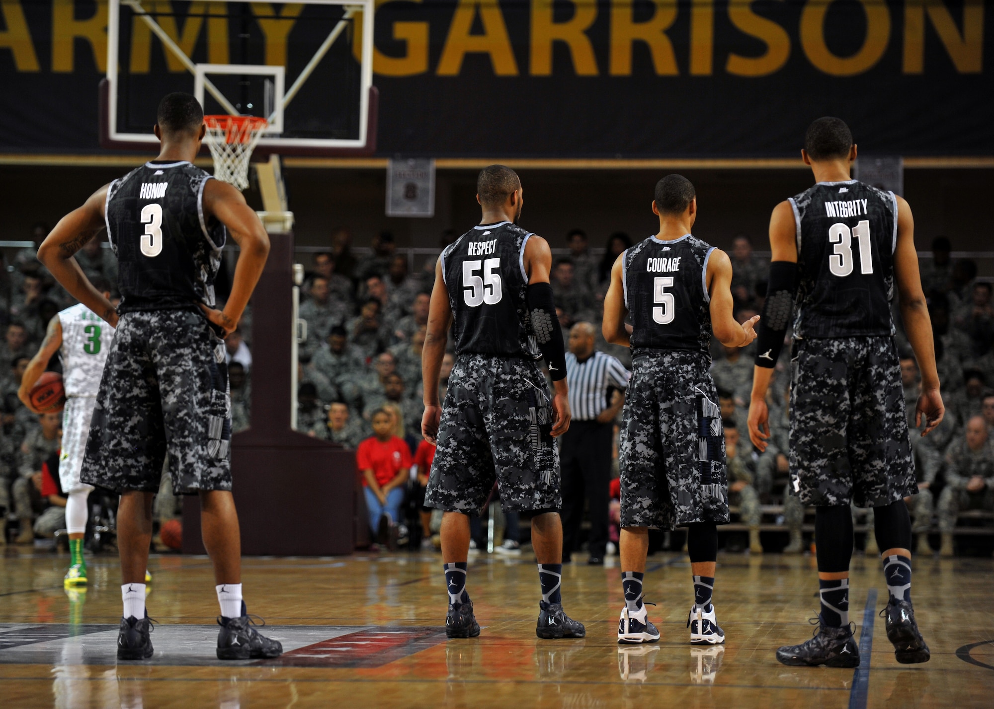 Basketball players from Georgetown University confer with each other after a technical foul was called during the Armed Forces Classic at U.S. Army Garrison Humphreys, Republic of Korea, Nov. 9, 2013. This year’s Armed Forces Classic pitted Georgetown against the University of Oregon, and was held at Humphreys to honor the men and women who are serving and who have served in the U.S. military. (U.S. Air Force photo/Senior Airman Siuta B. Ika)