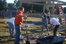 Marines from Marine Corps Air Station New River and Marine Corps Base Camp Lejeune, partner with United Way and the Home Depot Foundation to provide home renovations for a veteran in Hubert, N.C., as part of Operation Homefront, Oct. 25