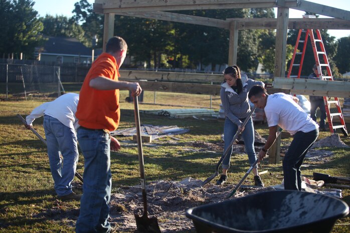 Marines from Marine Corps Air Station New River and Marine Corps Base Camp Lejeune, partner with United Way and the Home Depot Foundation to provide home renovations for a veteran in Hubert, N.C., as part of Operation Homefront, Oct. 25