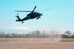 An HH-60 Pave Hawk with the 210th Rescue Squadron, Alaska Air National Guard, lands on the airfield in Galena, Alaska, to assist in the evacuation of residents from Galena, Alaska, May 28. The squadron was involved in the rescue of a man from a mine.