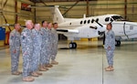 Soldiers assigned to the New York Army National Guard's Detachment 20, Operation Support Airlift Agency stand in formation Oct. 25, 2013, during their deployment ceremony.