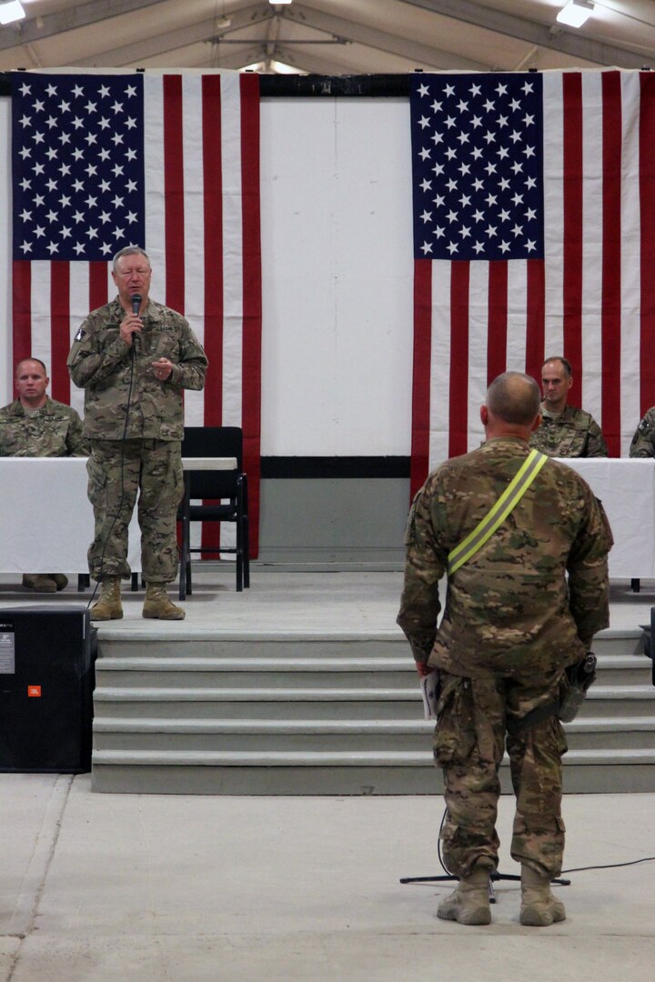 Gen. Frank Grass answers a question asked by a Guard member during a town hall at Kandahar Airfield, Afghanistan, Nov. 7, 2013. Grass visited KAF to meet with deployed Guard members and Regional Command (South) leadership.