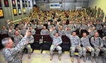 By a show of hands, Guard members deployed to Kosovo indicate to Army Gen. Frank Grass, the chief of the National Guard Bureau, and Air Force Chief Master Sgt. Mitch Brush, the chief's senior enlisted advisor, how many have completed state active duty missions for domestic responses before they deployed, Nov. 6, 2013.