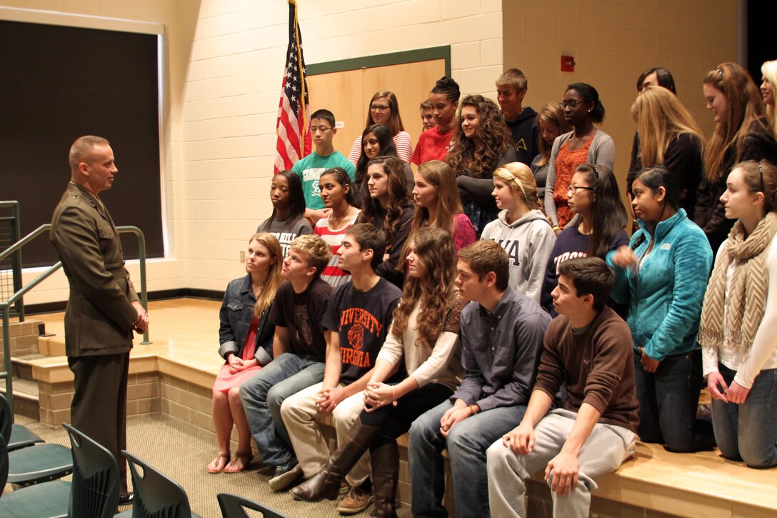 U.S. Marine Corps Brigadier General David Furness, left, Legislative Assistant to the Commandant of the Marine Corps, speaks to students of Clover Hill High School’s National History Honors society, Nov. 8, 2013. Furness, who graduated from the school in 1980, returned to his hometown to accept a Bravo Award, but also took time to share experiences and talk about the importance of leadership to the students. (U.S. Marine Corps photo by Cpl. Aaron Diamant/Released)