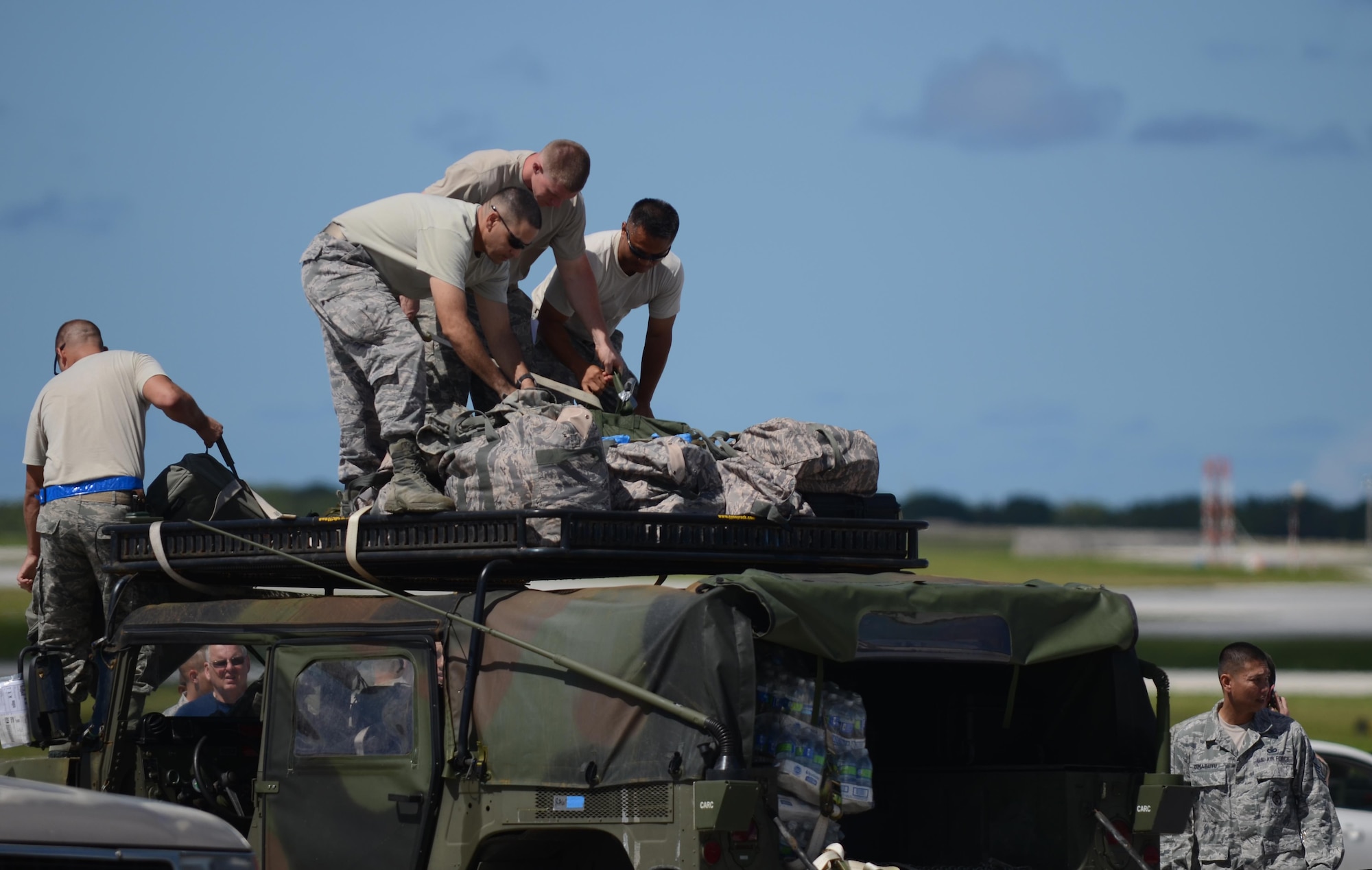 Airmen from the 36th Contingency Response Group secure equipment onto a Humvee Nov. 14, 2013, at Andersen Air Force Base, Guam, before departing to support Operation Damayan in Tacloban, Philippines. The Humvee will be used to access the airfield at Tacloban to determine if it is fit to receive C-17 Globemaster IIIs with supplies and equipment in support of the relief efforts. 