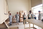 Third from left, Maj. Gen. Jovencio Magalso, Armed Forces of the Philippines deputy chief of staff for retiree and reserve affairs, observes the HMMWV Egress Assistance Trainer while touring the Guam Air National Guard facility on Andersen Air Force Base.
