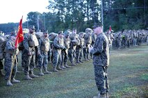 Navy Capt. Michael Sokolowski, the commanding officer of 2nd Medical Battalion, Combat Logistics Regiment 25, 2nd Marine Logistics Group, speaks to Marines and sailors within the battalion prior to a six mile hike aboard Camp Lejeune, N.C., Nov. 15, 2013. The purpose for the hike was twofold: to maintain mission readiness, and to raise food for families who otherwise wouldn’t be able to afford a Thanksgiving meal. (U.S. Marine Corps photo by Lance Cpl. Shawn Valosin)