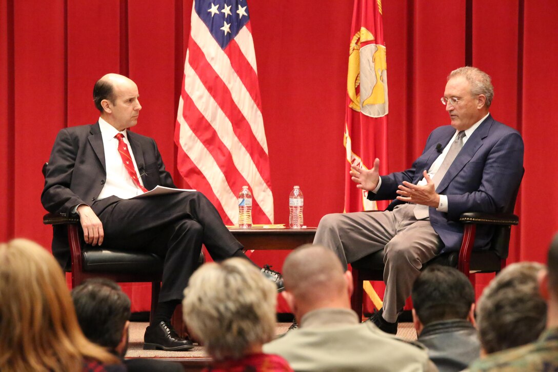 Christopher Harmon, Ph.D., Maj. Gen. Matthew C. Horner Chair of Military Theory, talks with Mark Bowden, author, journalist, screenwriter, during a Marine Corps University lecture series event. While at MCU, Bowden discussed various topics he’s written about.