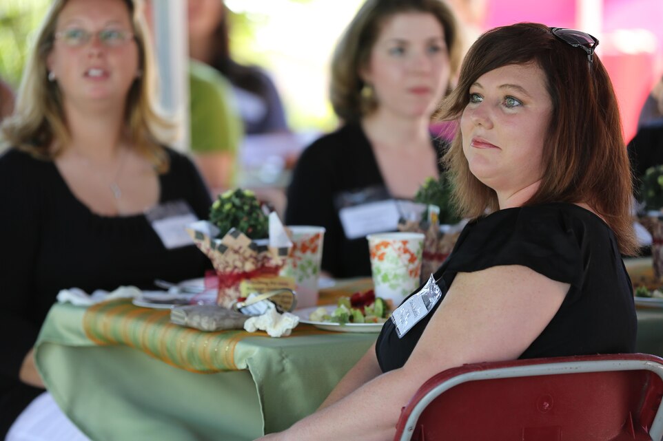 Carissa Bradbury, a volunteer with Marine Medium Tiltrotor Squadron 161 “Greyhawks”, listens as Maj. Gen. Steven Busby, 3rd Marine Aircraft Wing commanding general, speaks on the importance of the military spouse during a luncheon in their honor aboard Marine Corps Air Station Miramar, Calif., Oct. 18. Busby and his wife, Cindy Busby, hosted the event at their home as part of his Committed and Engaged Spouse Campaign. (Photo by Cpl. Melissa Wenger)