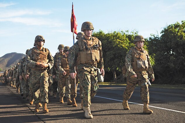 Col. Timothy Winand, commanding officer of 3rd Marine Regiment, and Sgt. Maj. Vincent Santiago, 3rd Marine Regiment sergeant major, lead from the front during a six-mile hike around Marine Corps Base Hawaii in honor of the Marine Corps birthday, Nov. 7, 2013. (U.S. Marine Corps photo by Cpl. Nathan Knapke)