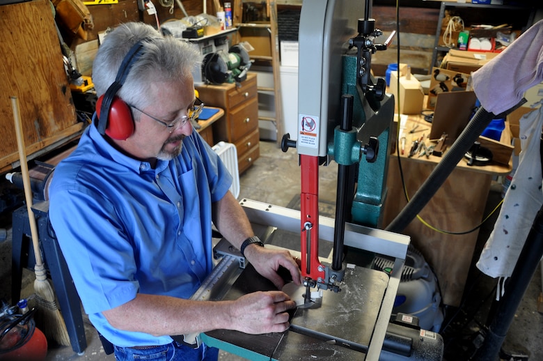 From his backyard workshop at his Savannah residence, David Lekson carves the shape of a duck's head from a piece of tupelo wood, Oct. 13, 2013. Photo by Tracy Robillard.