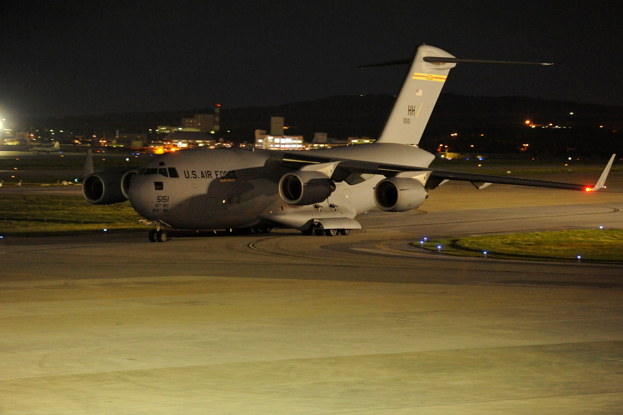 A C- 17 Globemaster III from Joint Base Pearl Harbor-Hickam, Hawaii, laden with supplies and joint service members departs Kadena Air Base, Japan, Nov. 15, 2013. This is one of many supply deliveries that will be made to assist the Philippines after Super Typhoon Haiyan. (U.S. Air Force photo by Senior Airman Marcus Morris) 