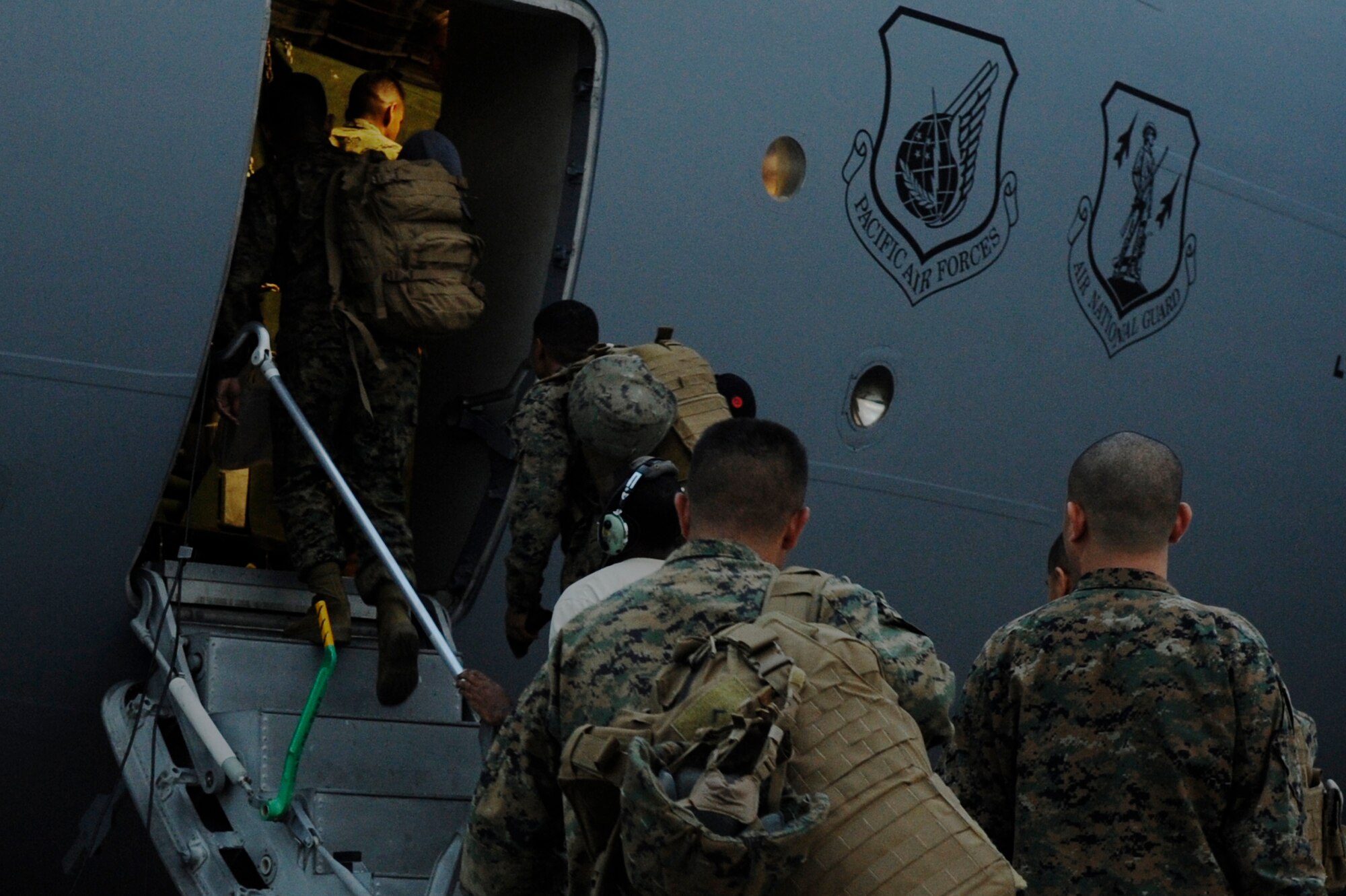 More than 50 Marines from the 3d Marine Expeditionary Brigade at Marine Corps Air Station Futenma, Okinawa, Japan, load onto a C- 17 Globemaster III from Joint Base Pearl Harbor-Hickam, Hawaii, on Kadena Air Base, Japan, Nov. 15, 2013. The Marines are part of Joint Task Force 505, and will be assisted by U.S. Air Force, Army and Navy to bring relief to the people of the Philippines. (U.S. Air Force photo by Senior Airman Marcus Morris)
