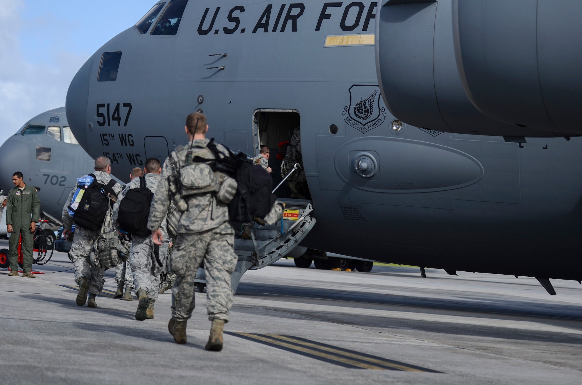 Airmen from the 36th Contingency Response Group board a C-17 Globemaster III Nov. 15, 2013, on the Andersen Air Force Base, Guam, flightline before departing to support Operation Damayan in Tacloban, Philippines. Operation Damayan is a U.S. humanitarian aid and disaster relief effort to support the Philippines in the wake of the devastating effects of Typhoon Haiyan. (U.S. Air Force photo by Senior Airman Marianique Santos/Released)