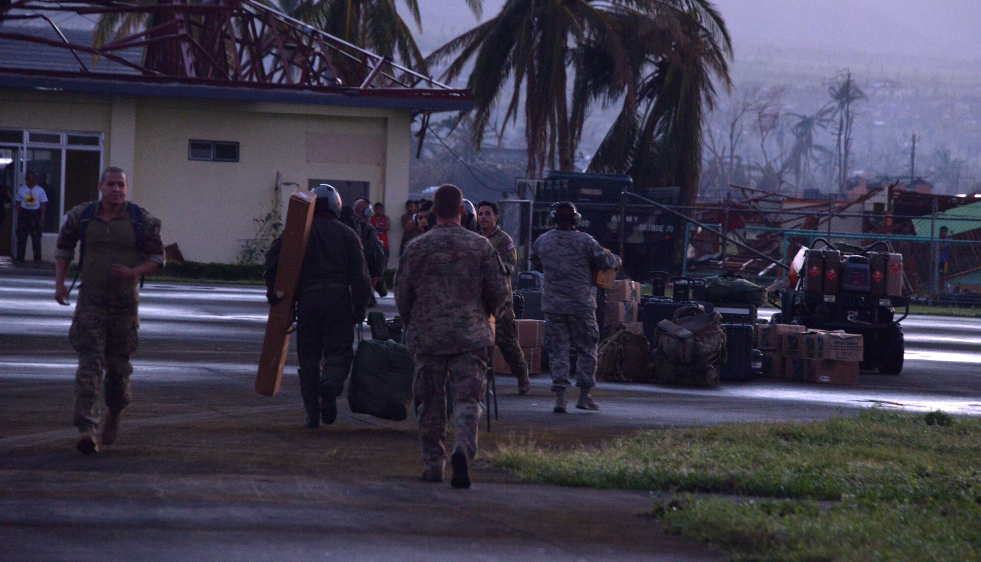 Airmen from the 353rd Special Operations Group offload equipment from an MC-130H Combat Talon II Nov. 15, 2013 at Ormoc Airport, Philippines. The Airmen, deployed in support of Operation Damayan, are assisting the Armed Forces of the Philippines and U.S. Marine Corps Forces Pacific as they provide aid in the aftermath of Typhoon Haiyan. (U.S. Air Force photo by Tech. Sgt. Kristine Dreyer)