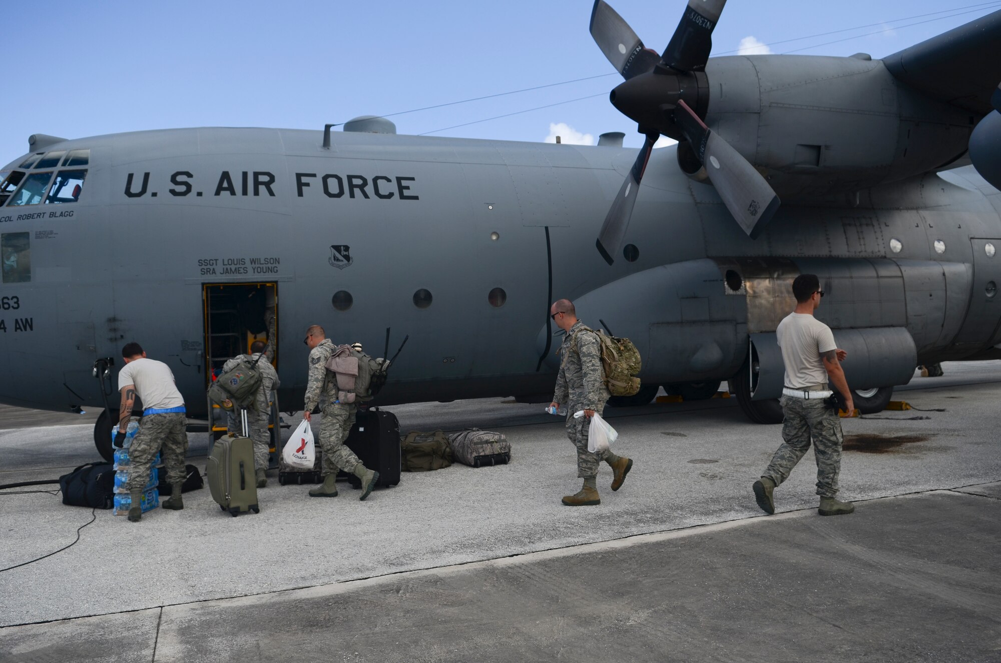 Airmen from the 36th Contingency Response Group board a C-130 Hercules bound for Tacloban, Philippines, Nov. 14, 2013, on the Andersen Air Force Base, Guam, flightline, in support of Operation Damayan. Operation Damayan is a U.S. humanitarian aid and disaster relief effort to support the Philippines in the wake of the devastating effects of Typhoon Haiyan. (U.S. Air Force photo by Senior Airman Marianique Santos/Released)