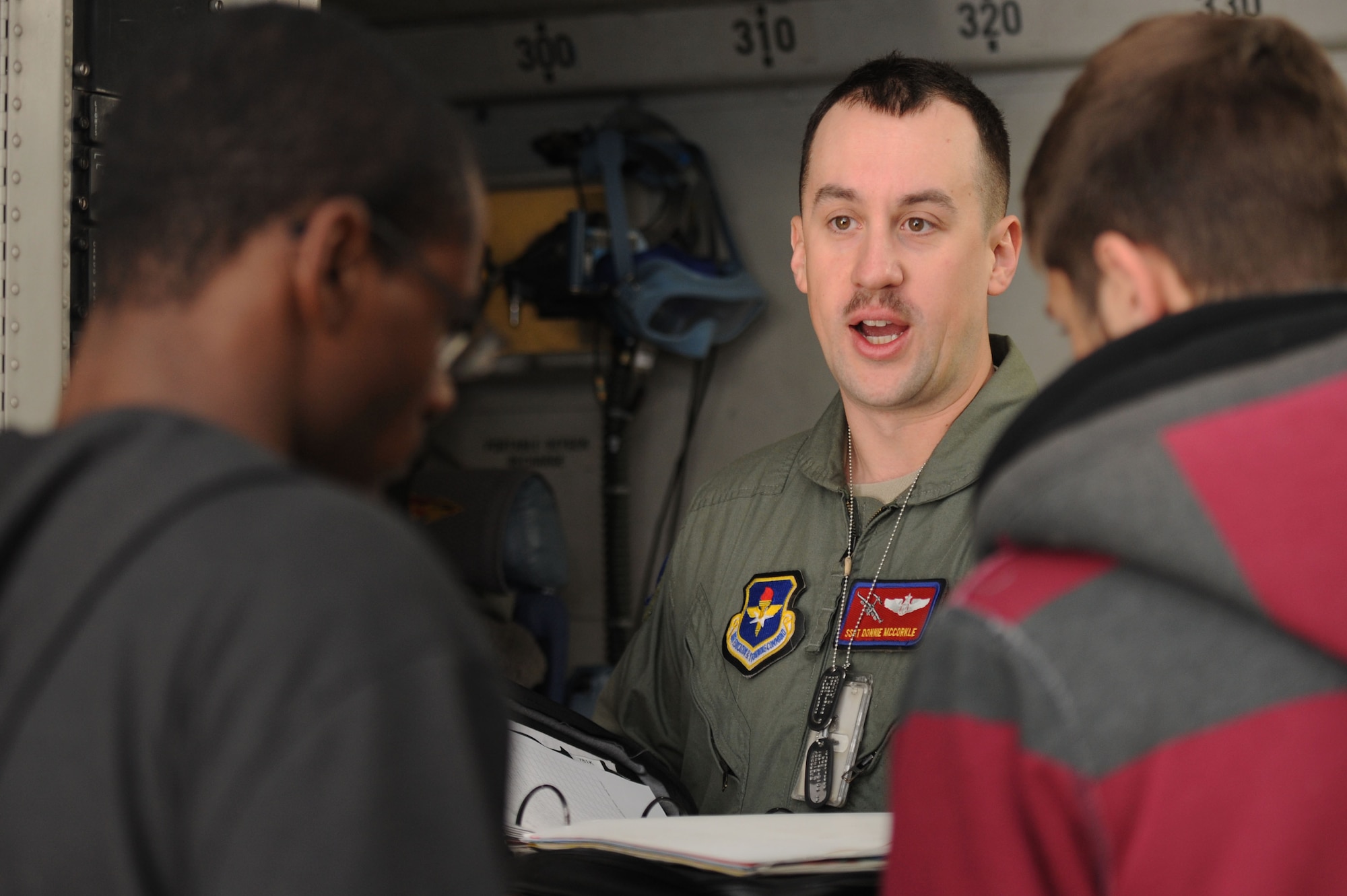 ALTUS AIR FORCE BASE, Okla. – U.S. Air Force Staff Sgt. Donnie McCorkle, 58th Airlift Squadron loadmaster, tells Junior Reserve Officers’ Training Corps high school students from Lawton, Okla. about the history of an Air Force C-17 Globemaster III cargo aircraft at a training display on the flight line Nov. 14, 2013. About 30 JROTC students from three different high schools in Lawton visited the base to learn about the Air Force mission and different Air Force specialty codes. The students also had the opportunity to attend a career fair and a military working dog demonstration during their visit. (U.S. Air Force photo by Airman 1st Class Klynne Pearl Serrano/Released)