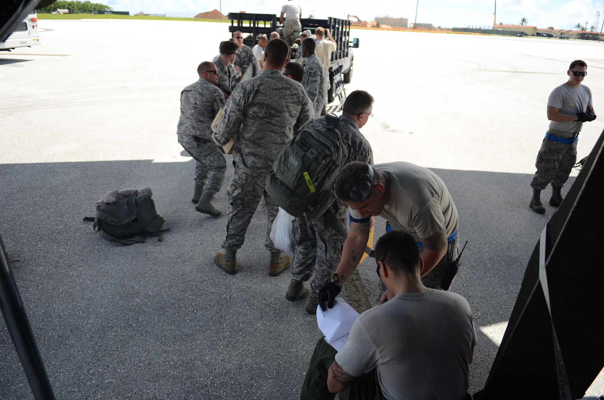 Airmen from the 36th Contingency Response Group transfer equipment from a truck into a C-130 Hercules Nov. 14, 2013, on the Andersen Air Force Base, Guam, flightline, before departing to support Operation Damayan in Tacloban, Philippines. Operation Damayan is a U.S. humanitarian aid and disaster relief effort to support the Philippines in the wake of the devastating effects of Typhoon Haiyan. (U.S. Air Force photo by Senior Airman Marianique Santos/Released)