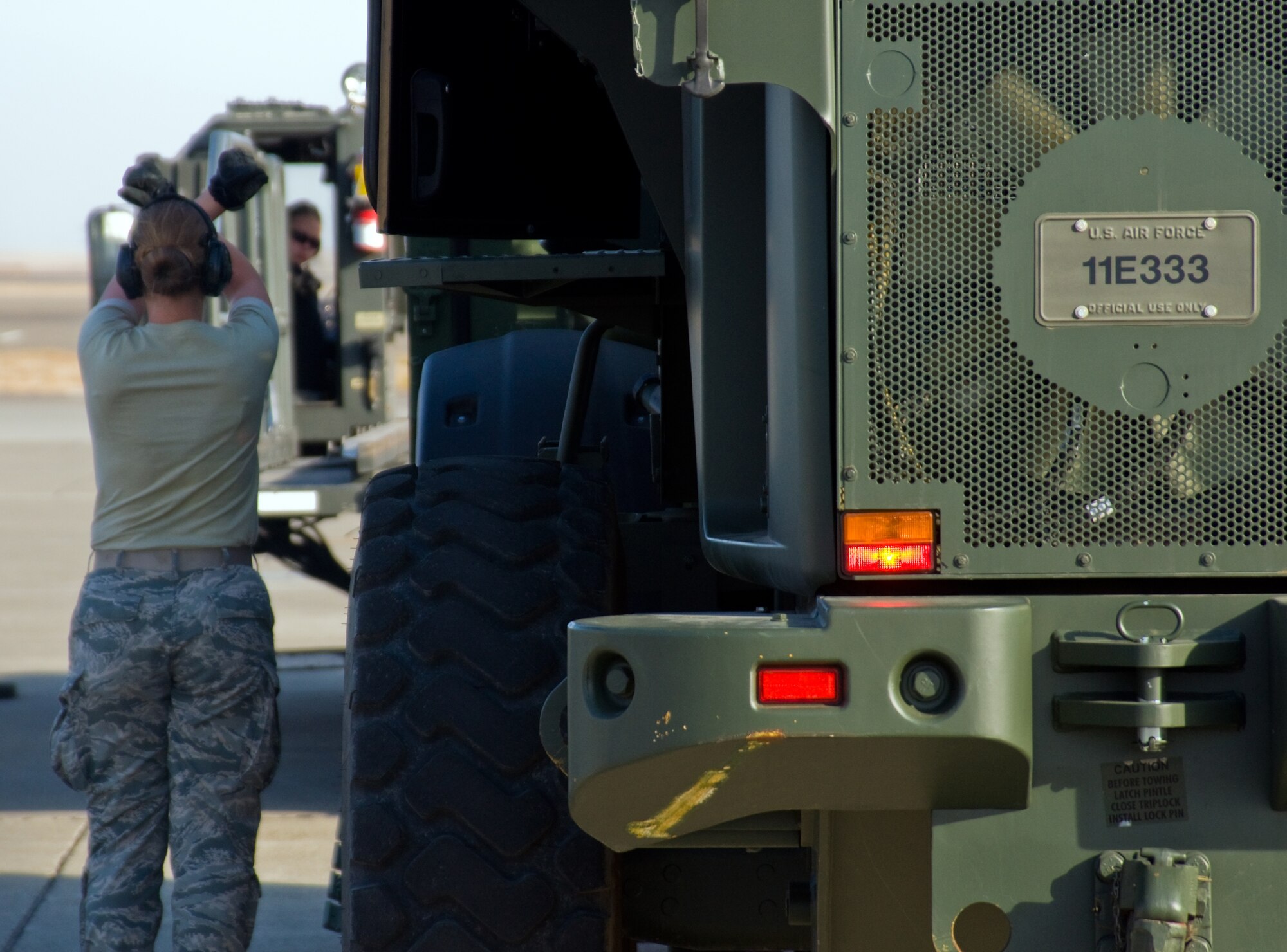 U.S. Air Force Airmen from the 621st Contingency Response Wing, load a cargo box onto a K-loader during a Golden Bear exercise Nov. 6, 2013, at Travis Air Force Base, Calif. (U.S. Air Force photo/Senior Airman Charles Rivezzo)