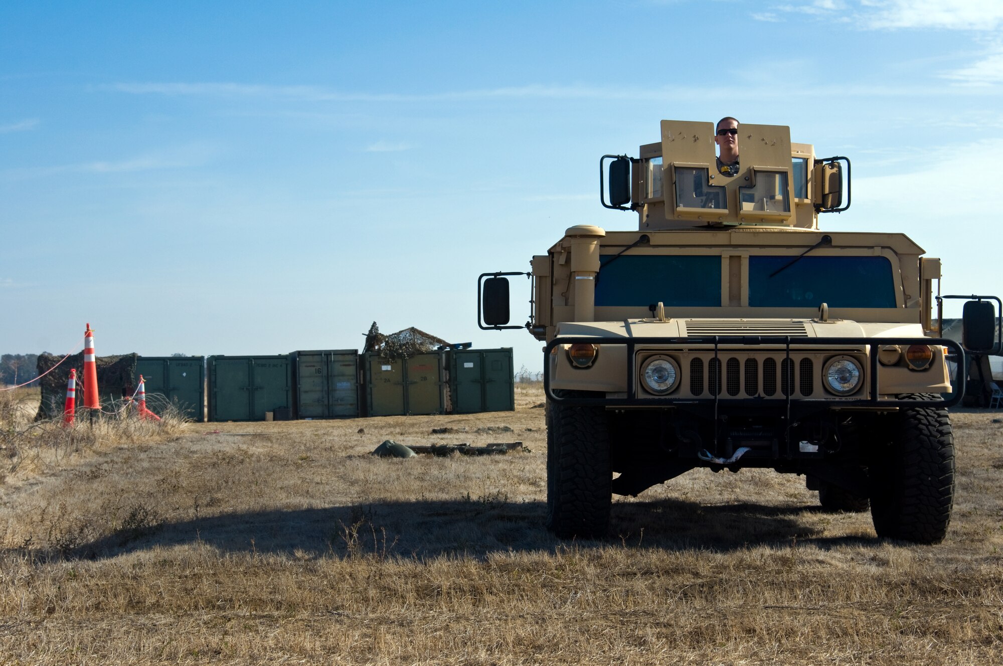 A U.S. Air Force Airman from the 570th Global Mobility Readiness Squadron stands watch at a mock forward operating base during a Golden Bear exercise Nov. 6, 2013, at Travis Air Force Base, Calif. (U.S. Air Force photo/Senior Airman Charles Rivezzo)