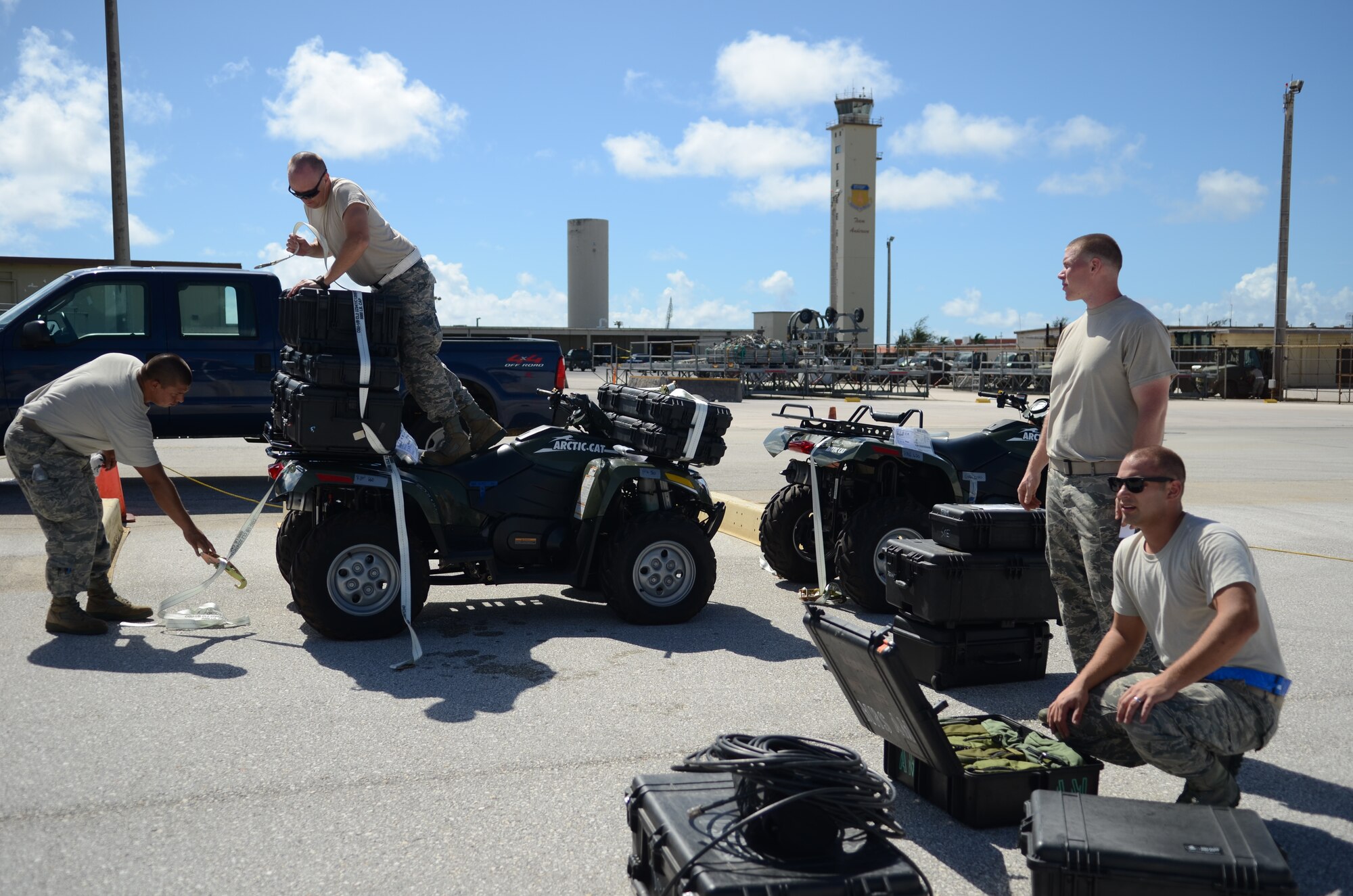 Airmen from the 36th Contingency Response Group prepare equipment and vehicles for transport Nov. 14, 2013, on the Andersen Air Force Base, Guam, flightline, before departing to support Operation Damayan in Tacloban, Philippines. The vehicles will be used to access the airfield at Tacloban to determine if it is fit to receive C-17s with supplies and equipment in support of the relief efforts. Operation Damayan is a U.S. humanitarian aid and disaster relief effort to support the Philippines in the wake of the devastating effects of Typhoon Haiyan. (U.S. Air Force photo by Senior Airman Marianique Santos/Released)