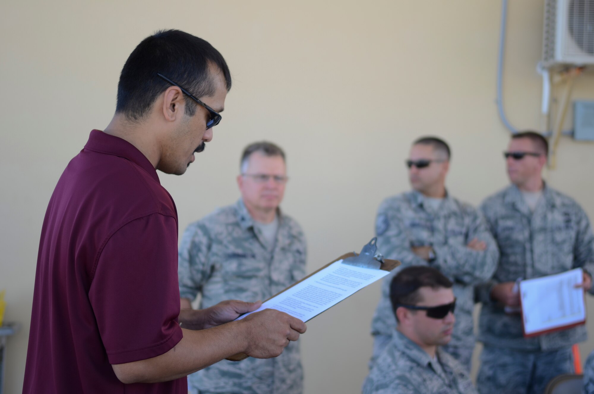 A logistics contractor briefs 36th Contingency Response Group Airmen regarding flight safety Nov. 14, 2013, on the Andersen Air Force Base, Guam, flightline, before boarding a C-130 Hercules bound for the Philippines to support Operation Damayan. Operation Damayan is a U.S. humanitarian aid and disaster relief effort to support the Philippines in the wake of the devastating effects of Typhoon Haiyan. (U.S. Air Force photo by Senior Airman Marianique Santos/Released)